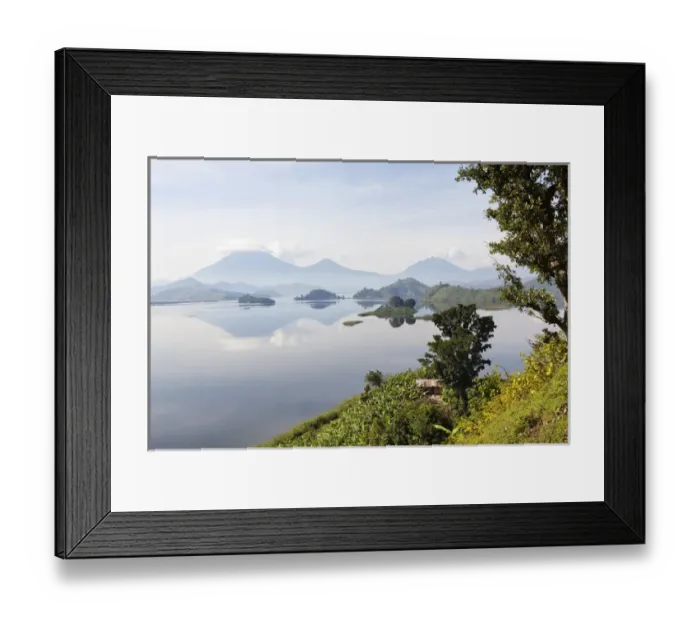 Framed Print : Lake Mutanda near Kisoro with the Virunga Vulcanoes as reflection in the lake Framed Print : Lake Mutanda near Kisoro with the Virunga Vulcanoes as reflection in the lake