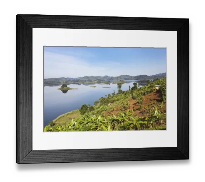 Framed Print : Lake Mutanda near Kisoro in Uganda. On the shoreline the land is cultivated, very Framed Print : Lake Mutanda near Kisoro in Uganda. On the shoreline the land is cultivated, very