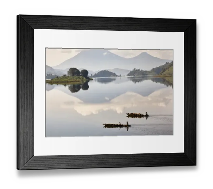 Framed Print : Dugout canoe floating on Lake Mutanda with the Virunga Vulcanoes in the background Framed Print : Dugout canoe floating on Lake Mutanda with the Virunga Vulcanoes in the background