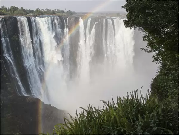 Africa, Zimbabwe, Victoria Falls. Landscape of waterfall and rainbow