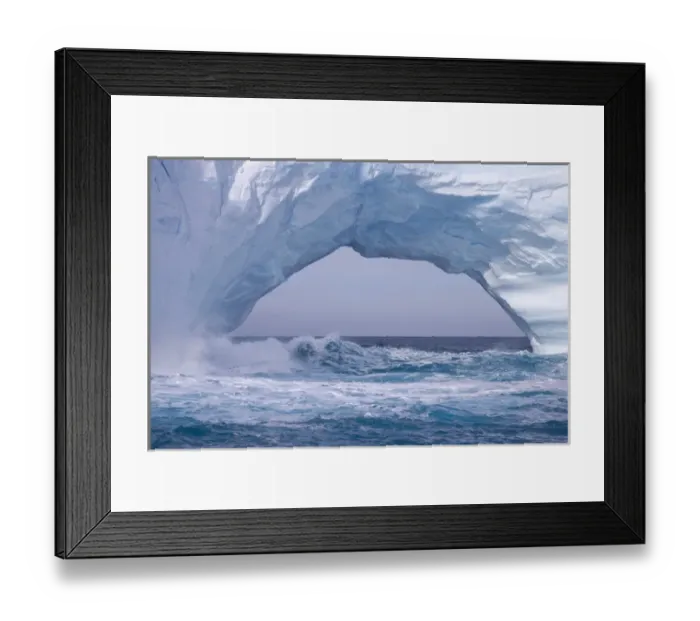 Framed Print : United Kingdom Territory, South Georgia Island. Waves splash under iceberg arch. Credit as Framed Print : United Kingdom Territory, South Georgia Island. Waves splash under iceberg arch. Credit as