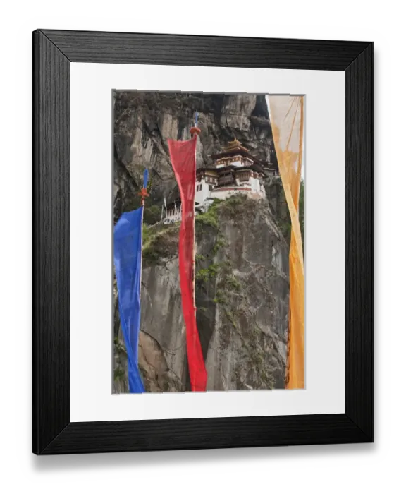 Framed Print : Asia, Bhutan. Prayer flags hang near Taktshang or Tigers Nest, the most famous monastery in Bhutan