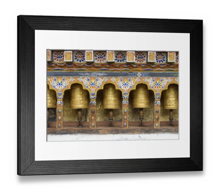 Framed Print : Bhutan. Spinning prayer wheels along a temple wall Framed Print : Bhutan. Spinning prayer wheels along a temple wall