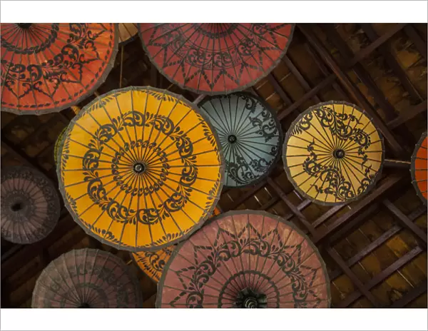 Myanmar, Mandalay. Umbrellas hanging from restaurant ceiling
