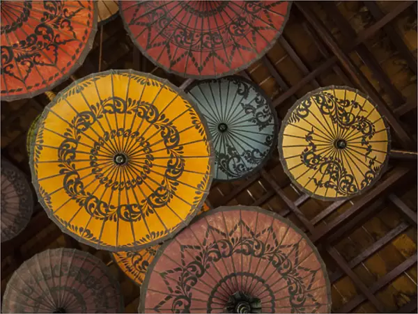Myanmar, Mandalay. Umbrellas hanging from restaurant ceiling