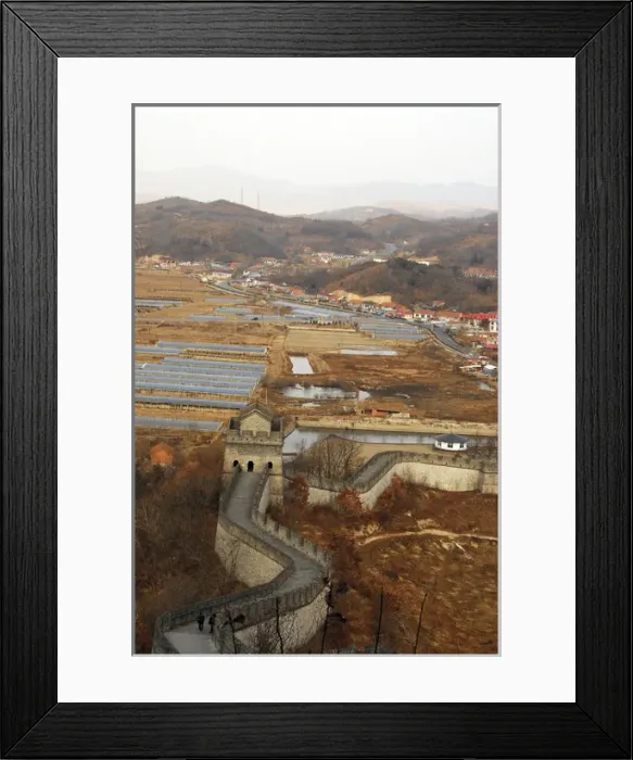 Framed Print : China, Dandong, elevated view of the Great Wall of China with houses and mountains