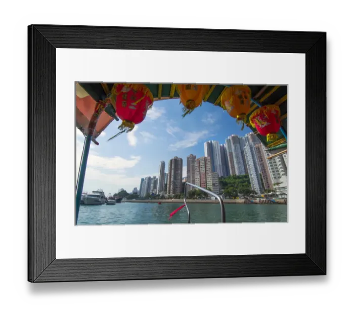 Framed Print : Hong Kong China Aberdeen from boat in water of reclaimed land with sktscraper condos Framed Print : Hong Kong China Aberdeen from boat in water of reclaimed land with sktscraper condos