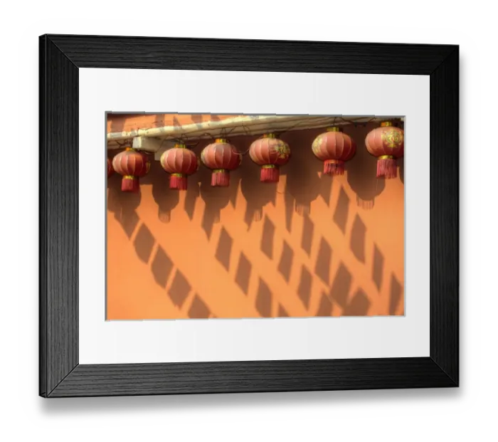 Framed Print : Chinese Lanterns and shadows playing on colorful wall in Kunming Ethnic Minorities Village Park