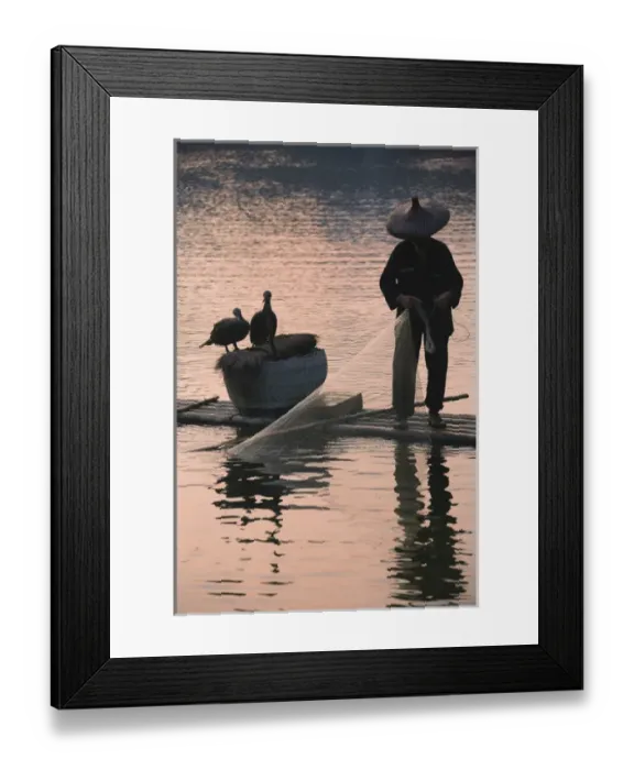 Framed Print : Fisherman fishing with cormorants on bamboo raft on Li River at dusk, Yangshuo, Guangxi Framed Print : Fisherman fishing with cormorants on bamboo raft on Li River at dusk, Yangshuo, Guangxi