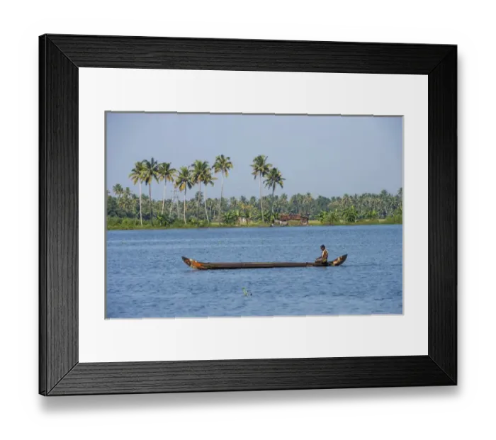 Framed Print : Man rowing a long wooden canoe, Backwaters, Kerala, India Framed Print : Man rowing a long wooden canoe, Backwaters, Kerala, India