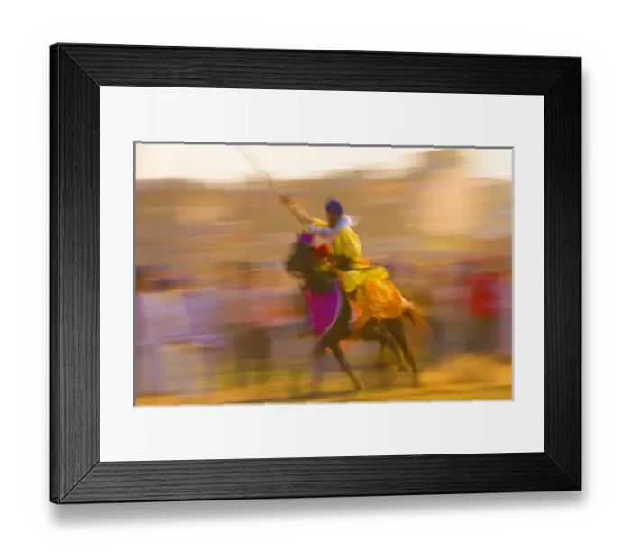 Framed Print : India, Punjab, Anandpursahib. Blurred rider and horse ride past crowd at Hollamohalla Festival Framed Print : India, Punjab, Anandpursahib. Blurred rider and horse ride past crowd at Hollamohalla Festival