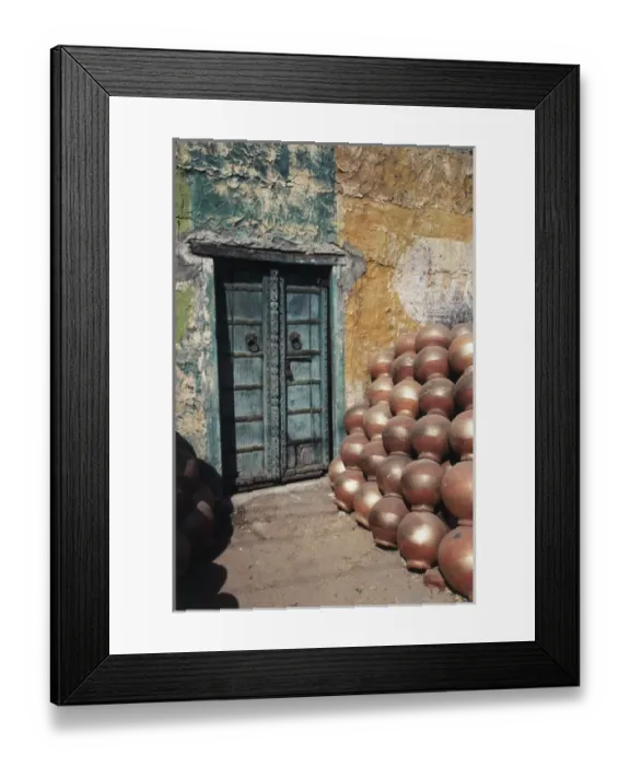 Framed Print : India, Rajasthan, Ceramic pot shop with iron doorway in background Framed Print : India, Rajasthan, Ceramic pot shop with iron doorway in background