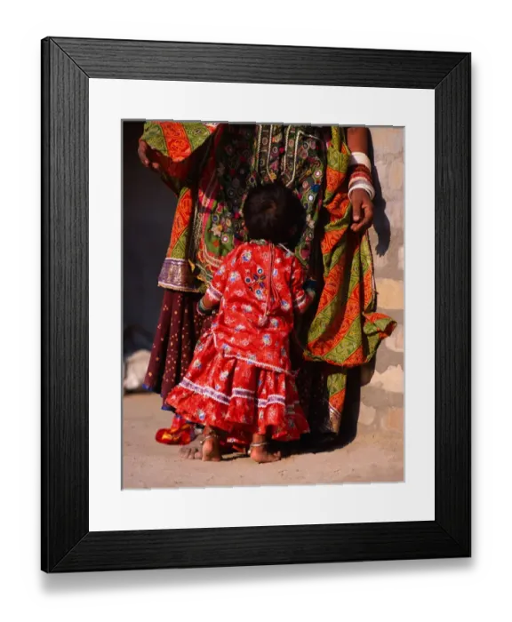 Framed Print : India, Gujurat. Shy child hugs Megwar Tribe woman mother