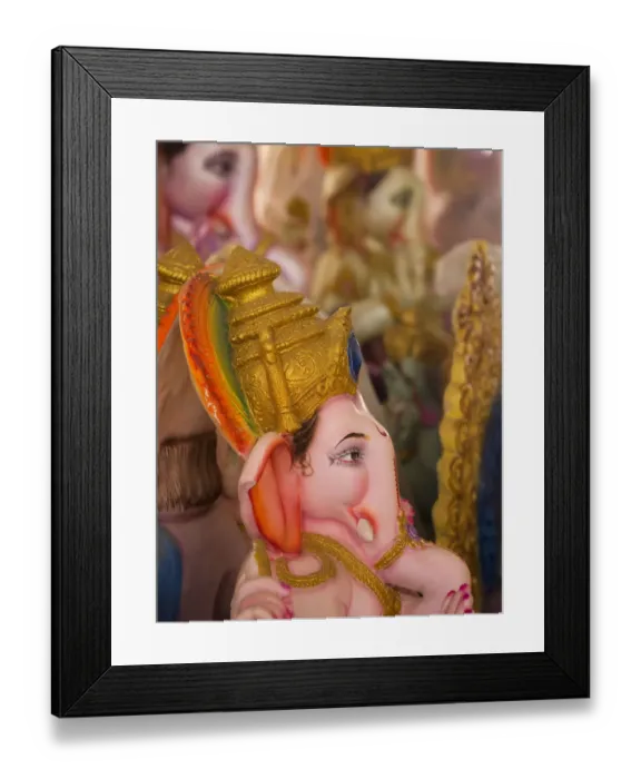 Framed Print : A finished Ganesha statue waits to be sold for the Ganesha Chaturthi festivities in Bangalore