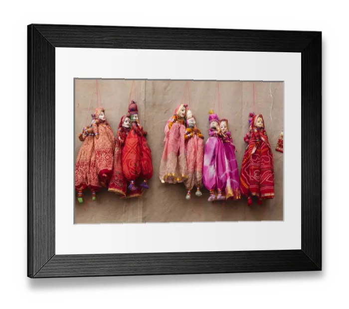 Framed Print : India, Rajasthan, Jhunjhunu District, Mandawa, Puppets hanging on wall
