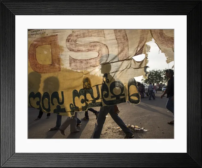 Framed Print : Torn cloth banner and street scene in Mysore, Karnataka, India Framed Print : Torn cloth banner and street scene in Mysore, Karnataka, India