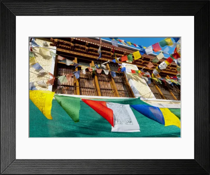 Framed Print : India, Jammu & Kashmir, Ladakh, prayer flags blowing in front of a traditional Ladakh
