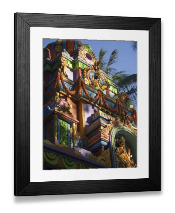 Framed Print : A colorful Hindu temple is decorated with colors and flower wreaths in Bangalore Framed Print : A colorful Hindu temple is decorated with colors and flower wreaths in Bangalore
