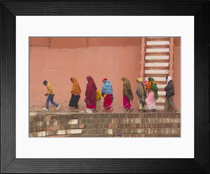 Framed Print : India, Uttar Pradesh, Varanasi. women and child walk along the Ganges river bulkhead