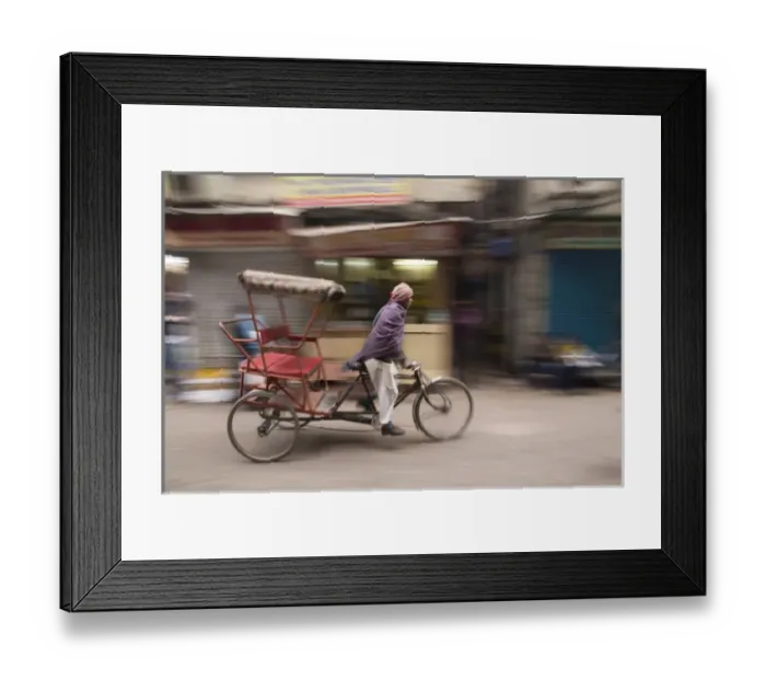 Framed Print : New Delhi, pedicab, rickshaw speeds down the narrow streets. Editorial Only Framed Print : New Delhi, pedicab, rickshaw speeds down the narrow streets. Editorial Only