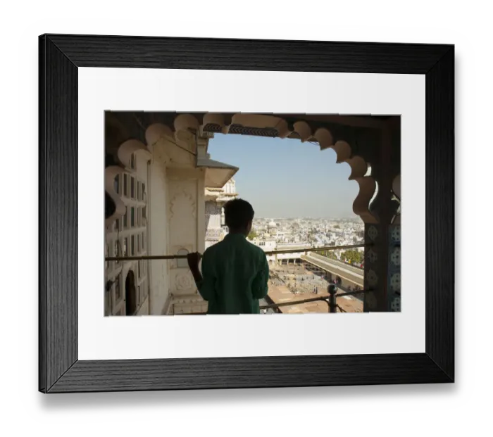 Framed Print : Boy looking out at the city below, City Palace, Udaipur, Rajasthan, India Framed Print : Boy looking out at the city below, City Palace, Udaipur, Rajasthan, India