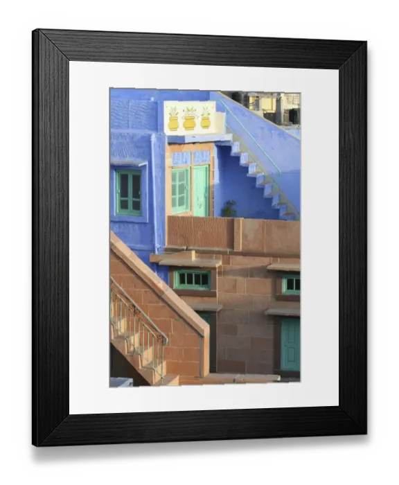 Framed Print : Blue City, Jodhpur, India. Blue apartment with a teal, green door, and painted flower pots Framed Print : Blue City, Jodhpur, India. Blue apartment with a teal, green door, and painted flower pots