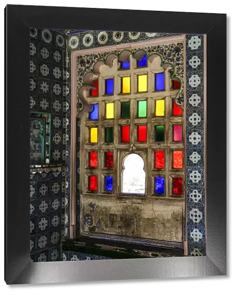 Udaipur, Rajasthan, India. Stain glass window with byzantine tile and scallop arch