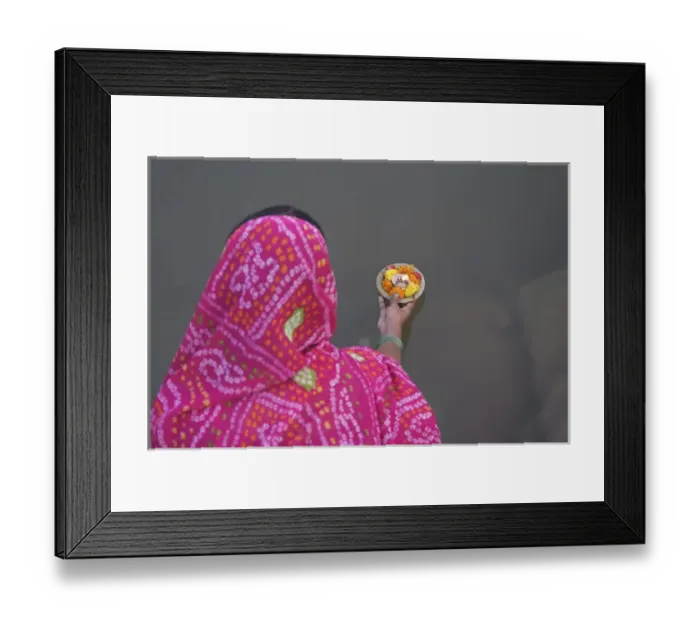 Framed Print : Woman putting flower lamp onto the Ganges River, Varanasi, India Framed Print : Woman putting flower lamp onto the Ganges River, Varanasi, India
