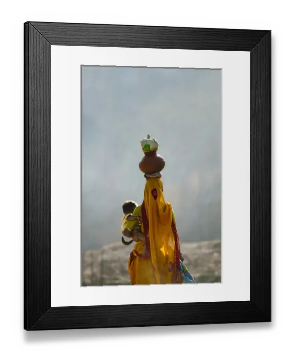 Framed Print : Village woman carrying baby and load on the head, Udaipur, Rajasthan, India Framed Print : Village woman carrying baby and load on the head, Udaipur, Rajasthan, India
