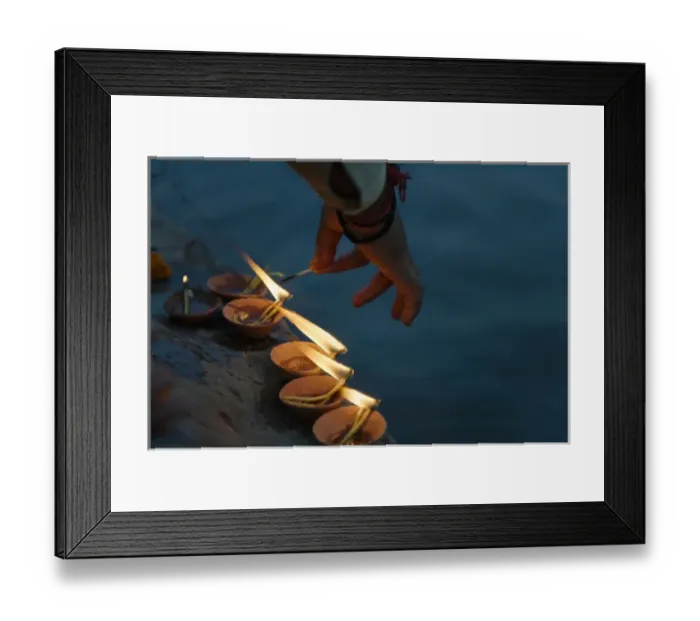 Framed Print : Lighting flower lamps by the Ganges River, Varanasi, India Framed Print : Lighting flower lamps by the Ganges River, Varanasi, India