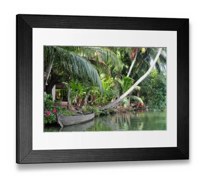 Framed Print : Asia, India, Kerala (Backwaters). A boat lays along a Kerala canal shoreline Framed Print : Asia, India, Kerala (Backwaters). A boat lays along a Kerala canal shoreline