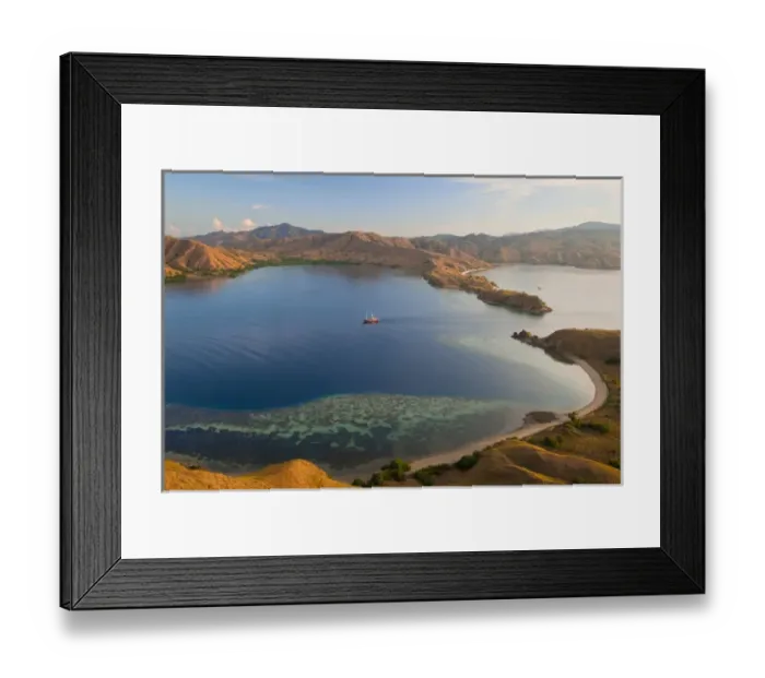 Framed Print : Indonesia, Komodo National Park. A phinisi schooner brings divers into a harbor. Credit as Framed Print : Indonesia, Komodo National Park. A phinisi schooner brings divers into a harbor. Credit as