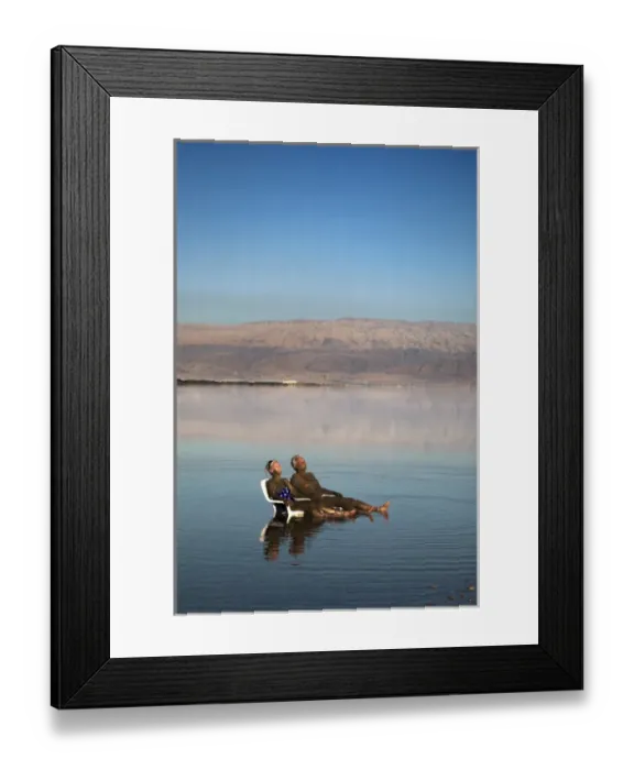 Framed Print : Israel; Dead Sea. A couple is covered in healing mud at the Dead Sea in Israel Framed Print : Israel; Dead Sea. A couple is covered in healing mud at the Dead Sea in Israel