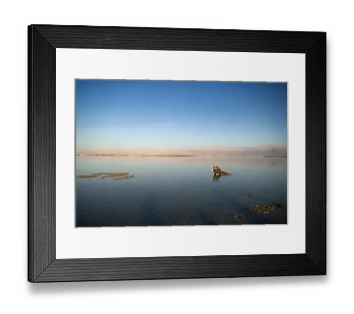 Framed Print : Israel; Dead Sea. A couple relaxes at the Dead Sea in Israel Framed Print : Israel; Dead Sea. A couple relaxes at the Dead Sea in Israel