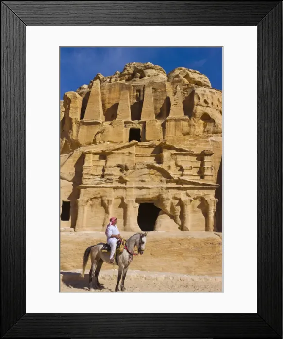 Framed Print : Man riding on horse with the Tomb of Obelisks, Petra, Jordan (UNESCO World Heritage site) Framed Print : Man riding on horse with the Tomb of Obelisks, Petra, Jordan (UNESCO World Heritage site)
