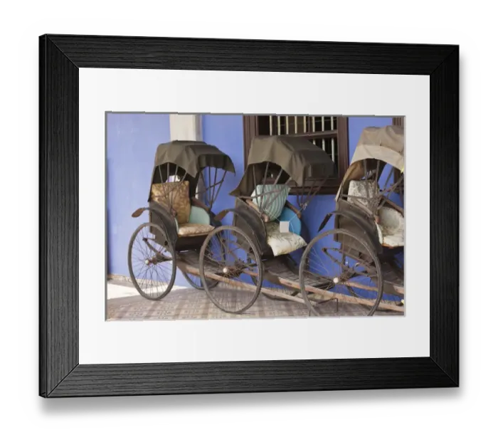 Framed Print : Malaysia, Penang. Traditional rickshaws lined up next to house Framed Print : Malaysia, Penang. Traditional rickshaws lined up next to house