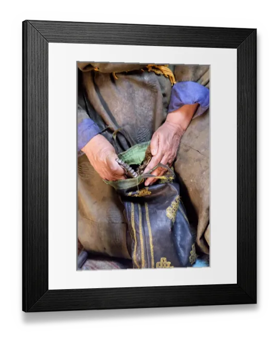 Framed Print : Asia, Western Mongolia, Mongolian woman takes tea and grinder from bag to prepare Framed Print : Asia, Western Mongolia, Mongolian woman takes tea and grinder from bag to prepare