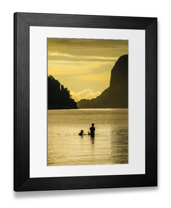 Framed Print : Young boys fishing at sunset in the bay of El Nido, Bacuit Archipelago, Palawan Framed Print : Young boys fishing at sunset in the bay of El Nido, Bacuit Archipelago, Palawan