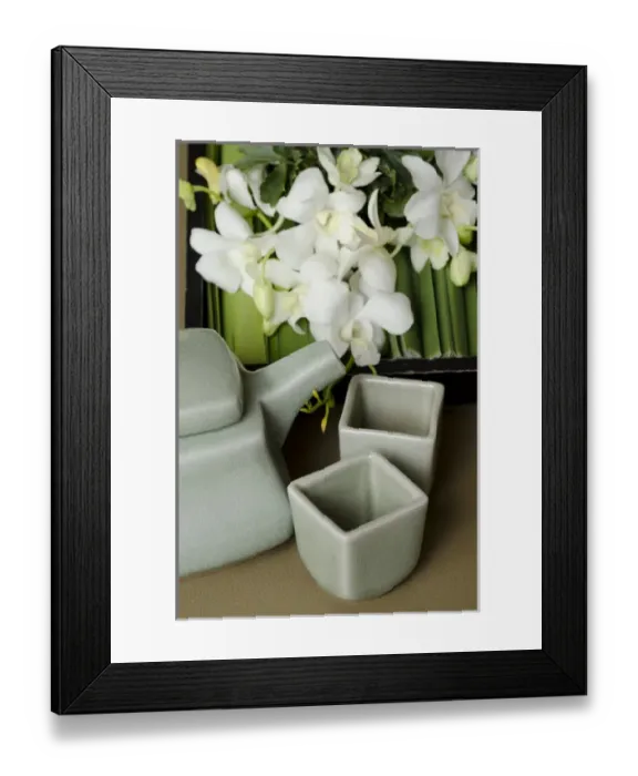 Framed Print : Thailand, Bangkok. Traditional Thai tea pot and cups with orchid arrangement