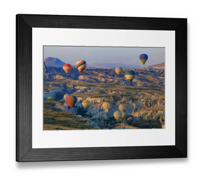 Framed Print : Turkey, Anatolia, Cappadocia, Goreme. Hot air balloons flying above  /  among rock formations