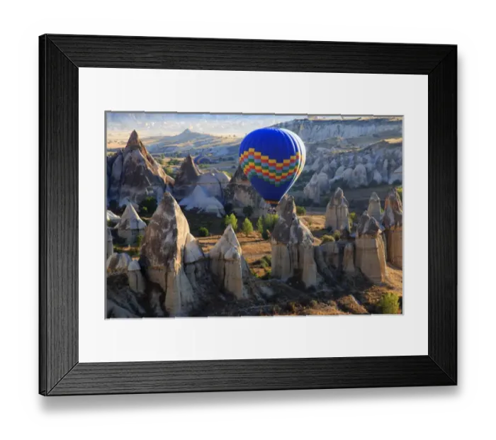 Framed Print : Turkey, Anatolia, Cappadocia, Goreme. Hot air balloon flying above / among rock formations Framed Print : Turkey, Anatolia, Cappadocia, Goreme. Hot air balloon flying above / among rock formations