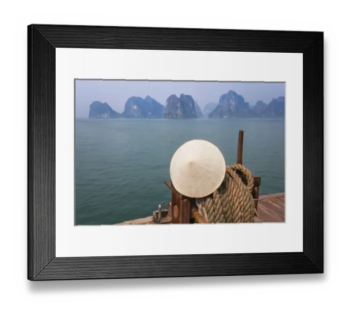 Framed Print : Conical hat on junk boat and karst islands in Halong Bay, UNESCO World Heritage site Framed Print : Conical hat on junk boat and karst islands in Halong Bay, UNESCO World Heritage site