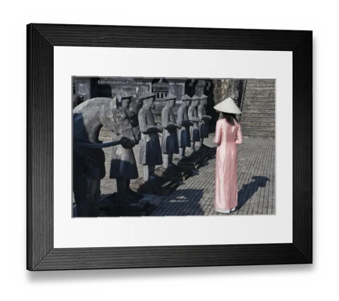 Framed Print : Girl in Ao Dai (traditional Vietnamese long dress) and conical hat at Tomb of King Framed Print : Girl in Ao Dai (traditional Vietnamese long dress) and conical hat at Tomb of King