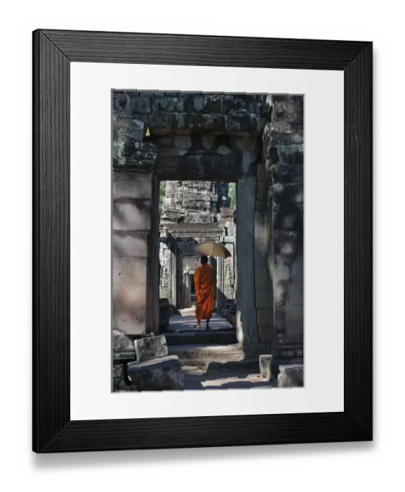Framed Print : Monk with Buddhist statues in Banteay Kdei, UNESCO World Heritage site