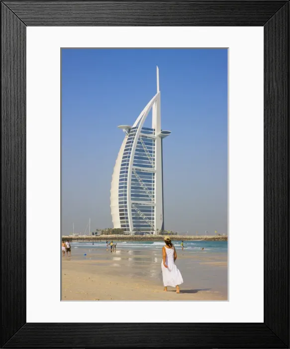 Framed Print : Tourists on the beach with Burj Al Arab Hotel in the distance, Dubai, UAE