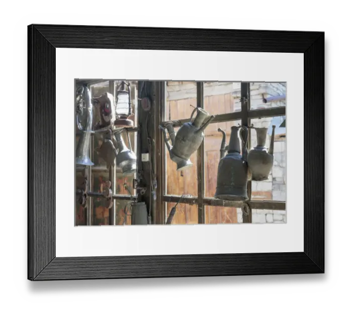 Framed Print : Azerbaijan, Lahic. Antique kettles hanging on the inside of a window