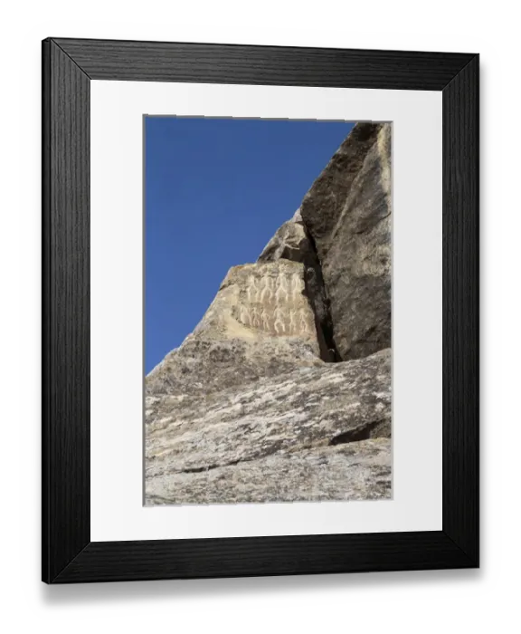Framed Print : Azerbaijan, Qobustan. Petroglyphs of people carved into a stone at Gobustan National Park