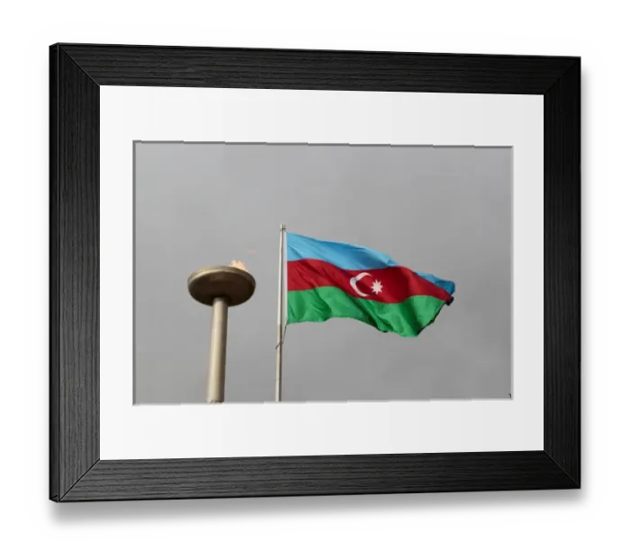 Framed Print : Azerbaijan, Baku. An Azerbaijan flag waves near a memorial flame Framed Print : Azerbaijan, Baku. An Azerbaijan flag waves near a memorial flame
