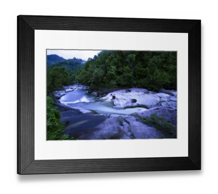 Framed Print : The Babinda Boulders is a fast-flowing river surrounded by smooth boulders and a Framed Print : The Babinda Boulders is a fast-flowing river surrounded by smooth boulders and a