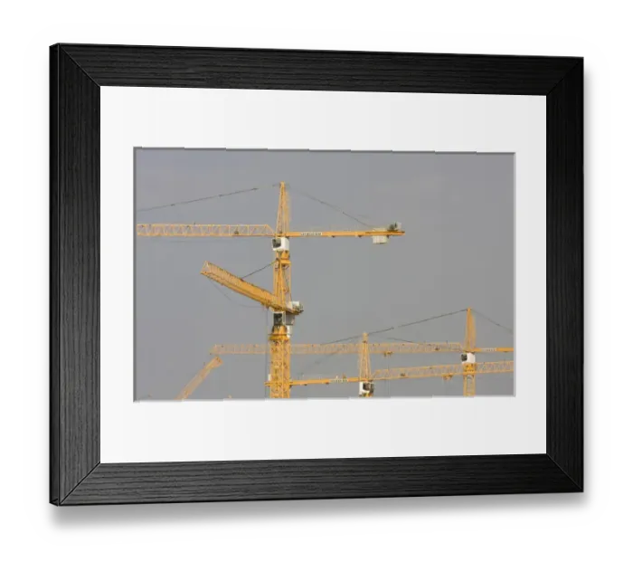 Framed Print : United Arab Emirates, Dubai, Marina. Yellow construction cranes against a grey sky Framed Print : United Arab Emirates, Dubai, Marina. Yellow construction cranes against a grey sky